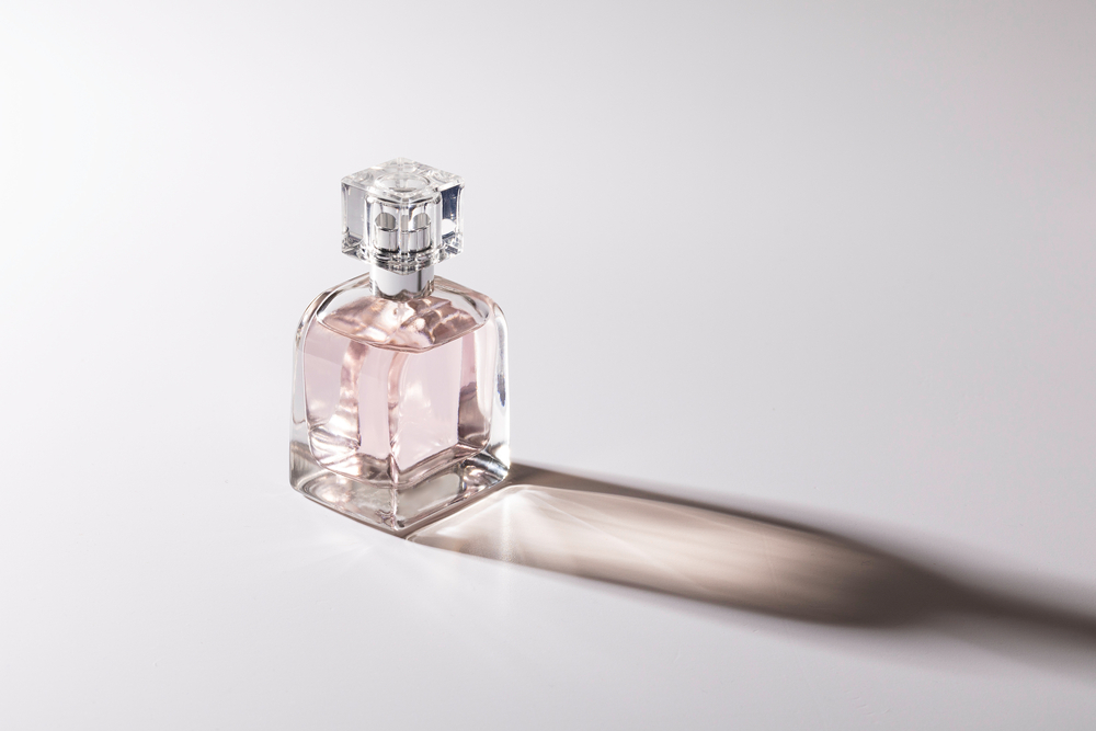 pink glass bottle of perfume